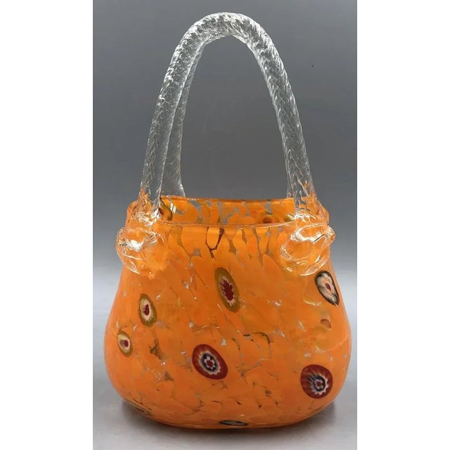 Finished in bright orange, this vase attracts everyone's attention and brings color and style to your home. The millefiori...