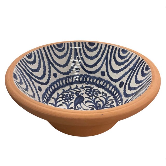 This charming vintage bowl showcases the vibrant artistry of traditional Spanish pottery. Crafted from rustic terracotta,...