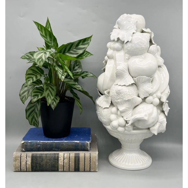 Beautiful vintage Italian ceramic fruit topiary featuring an abundant arrangement of pears, grapes, citrus, and leaves,...