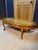 Elegant mid-20th century American French Provincial (Louis XV style) oval coffee table. Features graceful cabriole legs...