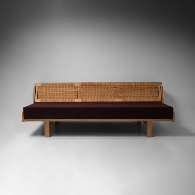 The ge258 sofa bed was designed by hans j. Wegner and made by getama and is a characteristic example of danish modern...