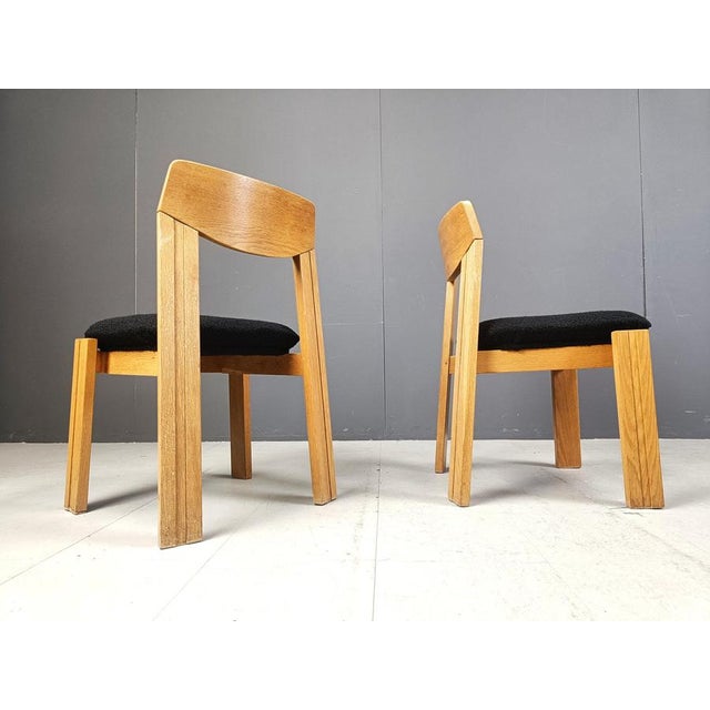 Mid century brutalist dining chairs with newly upholstered comfy black bouclé fabric. Very sturdy chairs with a nice...