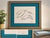 An elegant and highly collectible signed Artist Proof by celebrated marine life artist Wyland, featuring three dolphins...