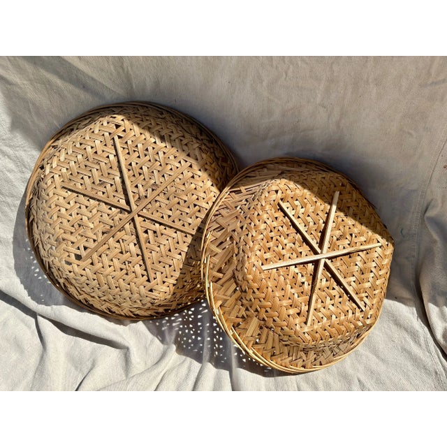 Woven rattan pair of baskets that can also be used as decor on the walls with other various rattan wall plates. Great with...