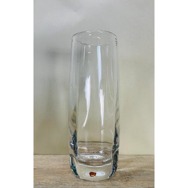 Vintage 1960s tall round clear glass vase handblown by Orrefors of Sweden. Marked with a paper label and underneath.
