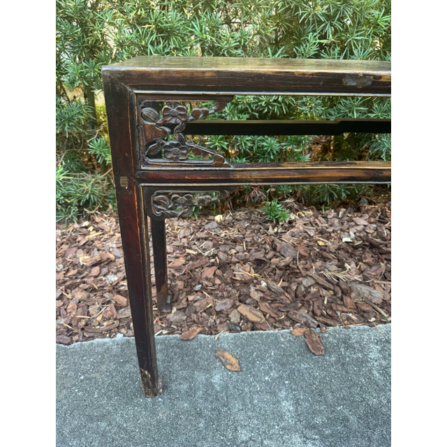 Old Asian altar/ console table. Worn finish. Subtle carved details, Greek key feet. Narrow depth for challenging spaces.