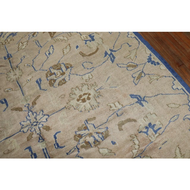 Mid 20th century Turkish Rug with brown and periwinkle /royal blue accents on a beige ground. Hand-knotted, all wool, one...