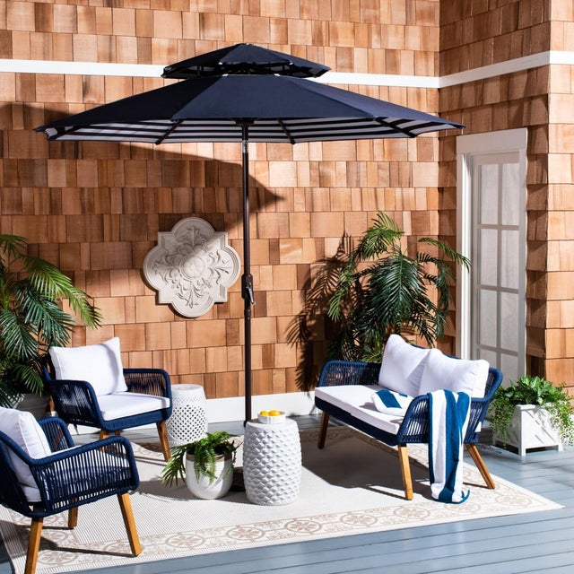 This nine foot crank umbrella was inspired by the sunbathing terrace of Monacos Mediterranean overlook hotels. Embracing...