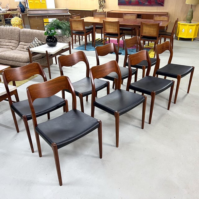 An exceptional and increasingly hard-to-find set of eight Model 71 dining chairs by Niels Otto Møller for J.L. Møller...