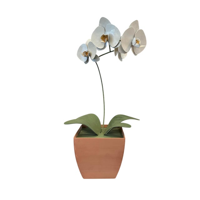 A lovely, vintage tole potted orchid. Features a hand painted metal orchid in white with yellow accents surrounded by...