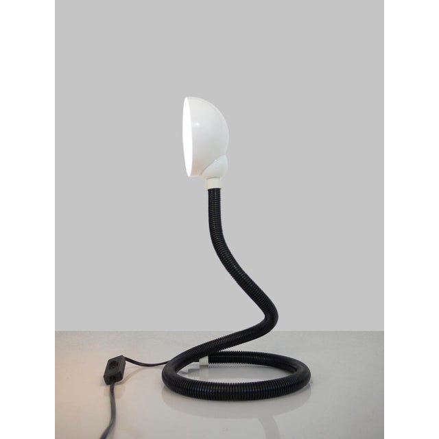 Original black and white flexible snake reading lamp made of metal and hard plastic. Designed by Eurolux for Mand GmbH,...