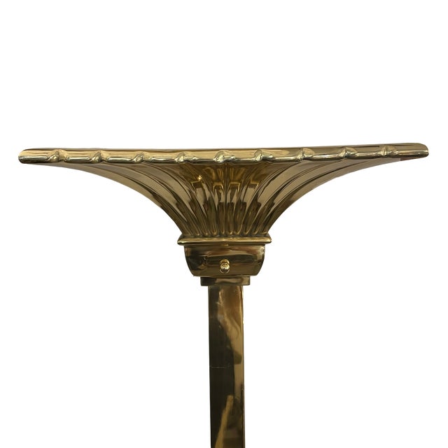 A pair of tasteful Empire-style floor sconces with a refined form and design. These two slender light fixtures are mounted...