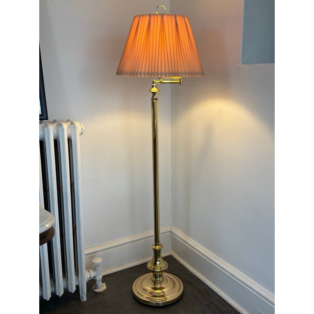 An elegant 1990s Hollywood Regency adjustable swing arm brass floor lamp. Please see condition details noted. Will be...