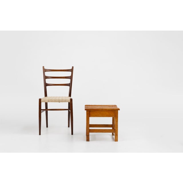 A charming and authentically crafted Belgian stool from around 1920, made entirely of solid wood. Its design reflects the...