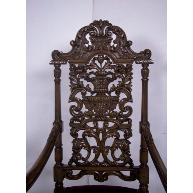 A dramatic and highly sculptural pair of Renaissance Revival “throne” armchairs, dating to the late 19th century, executed...