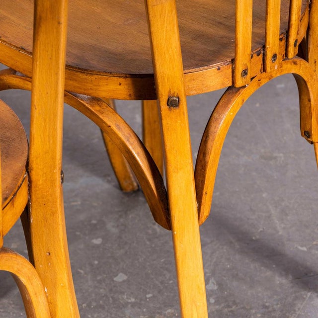 Classic set of 4 beech bistro chairs made in France by the maker Baumann. Baumann is a slightly off the radar French...