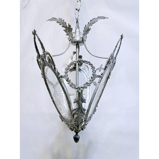 Silver gilded bronze Lantern with three etched glass panels. 3 light with candelabra base sockets. Each holds 75W light...