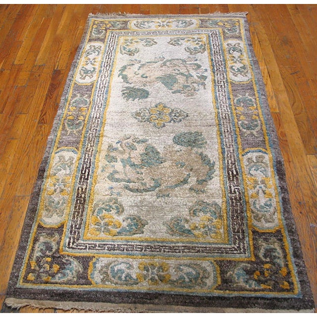 Antique Chinese - Tibetan Small Scatter Size Wool Ivory Rug, Circa Date: 1930s. This exquisite piece represents the...