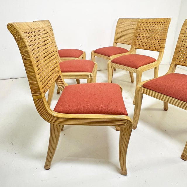 Set of six postmodern pencil reed dining chairs with double caned backs and wrapped feet, with klismos styled legs. They...