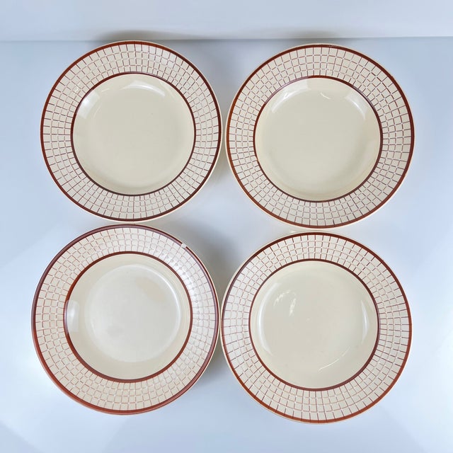 Set of 4 Longchamp soup plates, "Colmar" model, 1950/70 White ceramic In shades of cream, white and red/orange Entirely...
