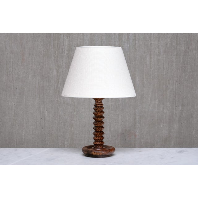 This rare table lamp was produced in France during the 1950s. The rustic yet elegant design is attributed to the French...