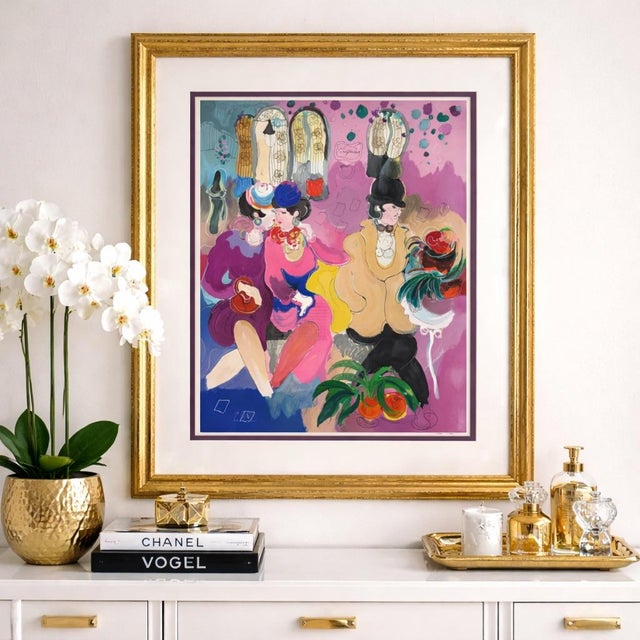 A vibrant and sophisticated limited-edition lithograph by Zule Moskowitz titled “El Patio.” This elegant fashion scene,...