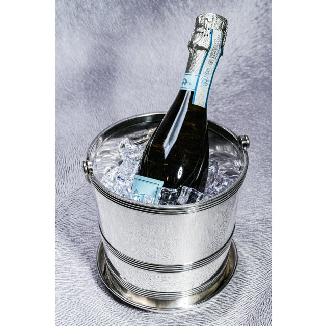 Elevate your barware collection with this classic Mid-Century Modern silverplate ice bucket, a beautifully crafted...
