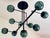 Scenographic chandelier with green-petrolio spheres in Murano glass . The spheres are working in "ballotton" a traditional...