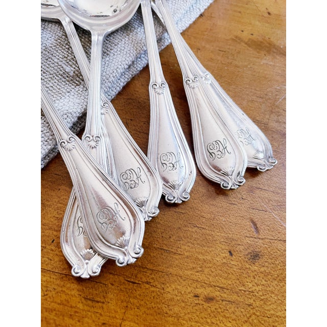 A set of 6 antique silver plated round bowl cream soup spoons made by Tiffany & Co in the 1907 Whittier pattern. In...