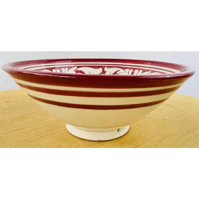 A set of 4 large vintage tribal Moroccan hand painted ceramic bowls. In a white and burgundy tone, each bowl features...