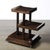 This Art Deco three-tier walnut side table, crafted in France circa 1935, epitomizes the refined elegance and geometric...
