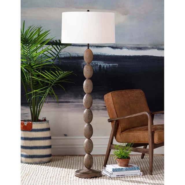 Refined birch wood of the Buoy floor lamp, evokes sea-side tranquility. Complimented with an natural linen drum shade and...