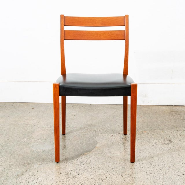 Solid teak dining chair by Svegards, Sweden in original black vinyl. Classic look and design. Clean, functional and stylish.