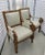 A high quality pair of ornately hand carved wood armchairs with scrolled arms. Custom upholstered by Sherrill, these were...