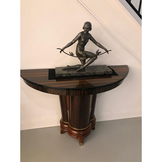 French Art Deco female sculpture on marble. Deco girl holding branch with birds playing. Adding the perfect deco decor to...