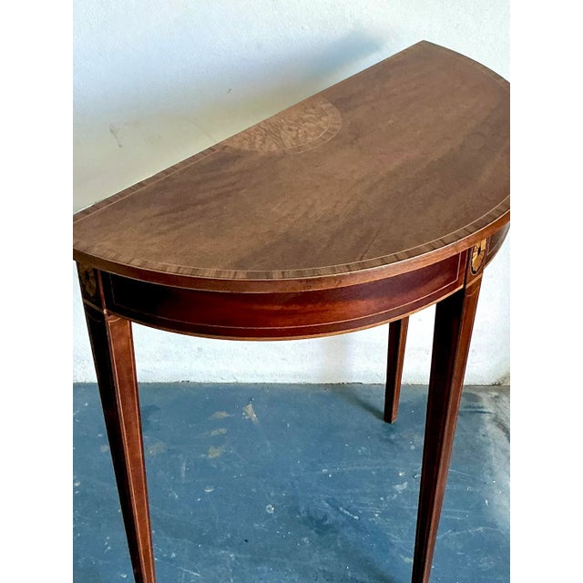 Presenting a superb Vintage Regency Marquetry Demilune Console Table, an elegant piece that effortlessly blends historical...