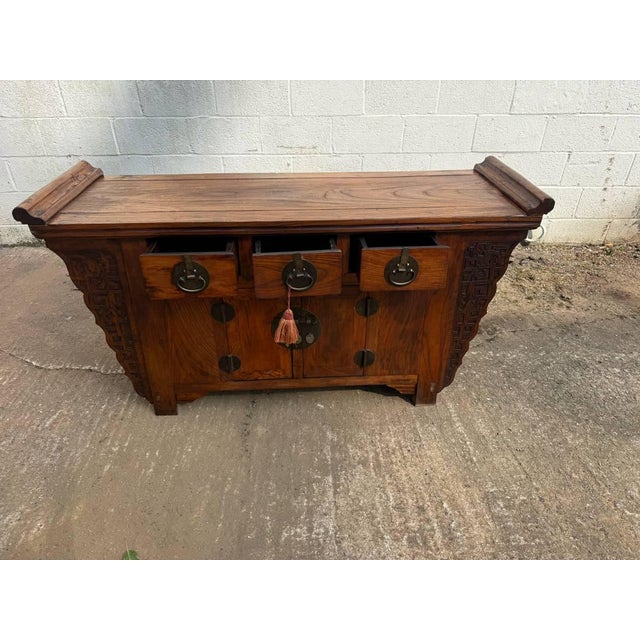 Antique Chinoiserie style elm wood carved butterfly altar sideboard. Solid wood frame, hand carved in circa late 19th to...