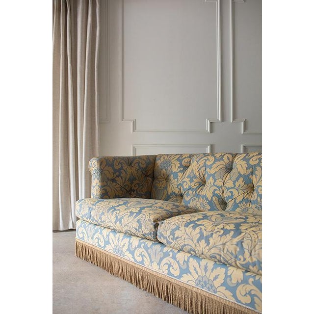 Well crafted vintage Napoleon III style two-seat sofa, evoking the timeless grandeur of 19th-century French salons. Deep...