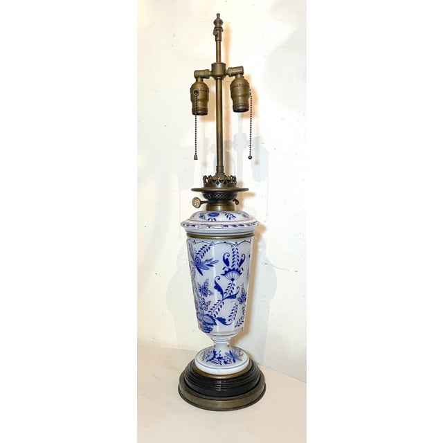 Up for sale is a high quality antique 19th century electrified oil lamp. It's made of a thick white toned glass and...