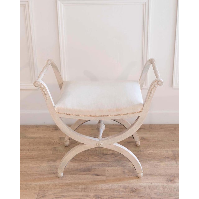 A period Gustavian stool with handles, scraped to original paint