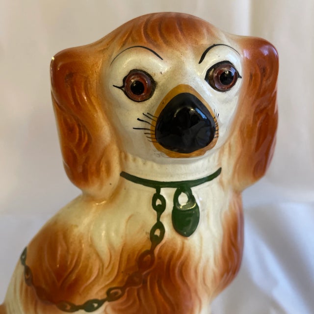 Antique Victorian pair of Staffordshire King Charles spaniels with glass eyes. Hand painted. Green locks and chains....