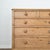 A warm antique pine chest of drawers crafted from solid pine, this piece carries a soft, timeworn patina with beautifully...