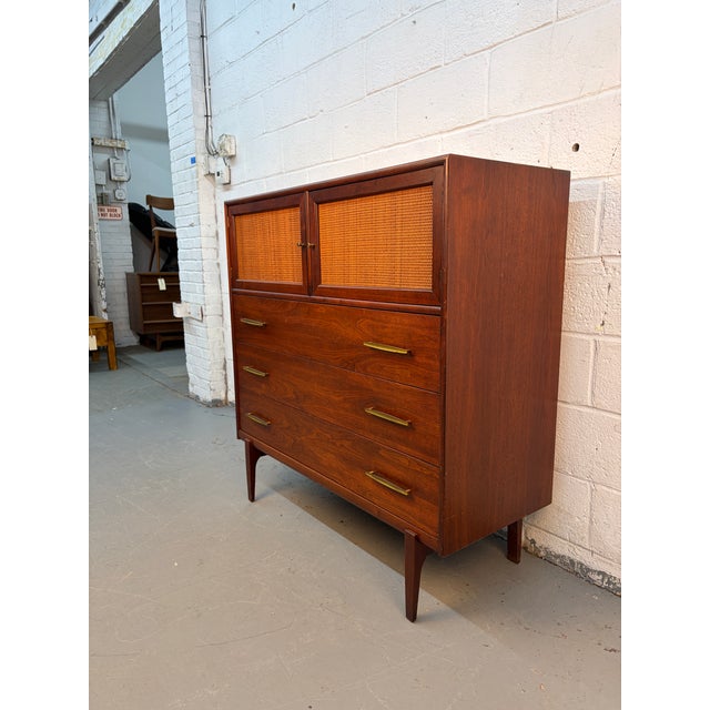 Highboy dresser by Ramseur Furniture. Beautifully constructed from rich walnut, this piece showcases warm tones and...