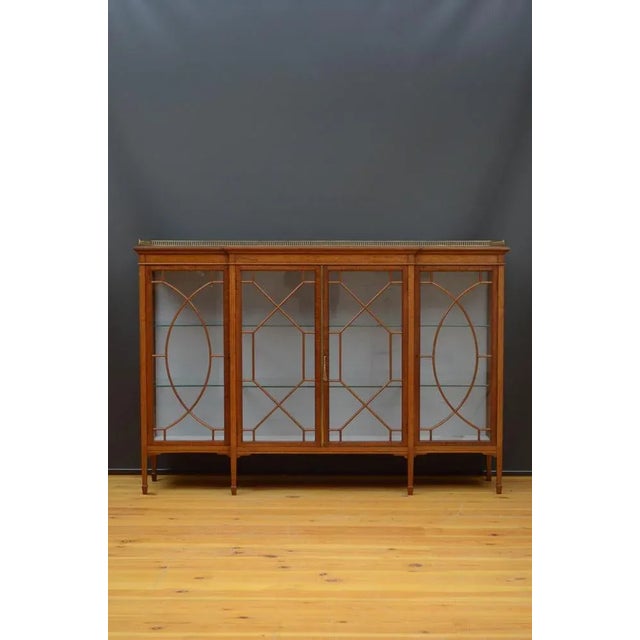 Sn5470 superb quality and very attractive edwardian break fronted china cabinet, having original brass gallery to the...