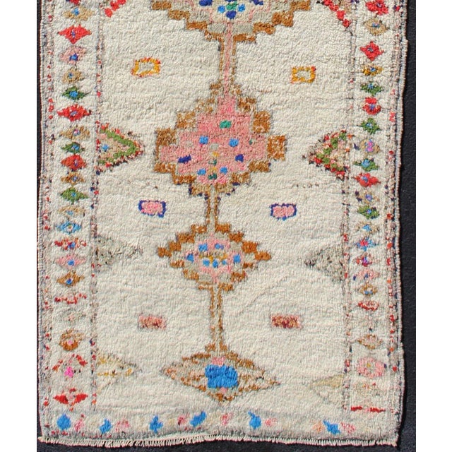 Measures: 3'9 x 11'4 Vintage Turkish Tulu Runner with Ivory, Rose, Blue, and Multicolor 3'9 x 11'4. Keivan Woven Arts /...