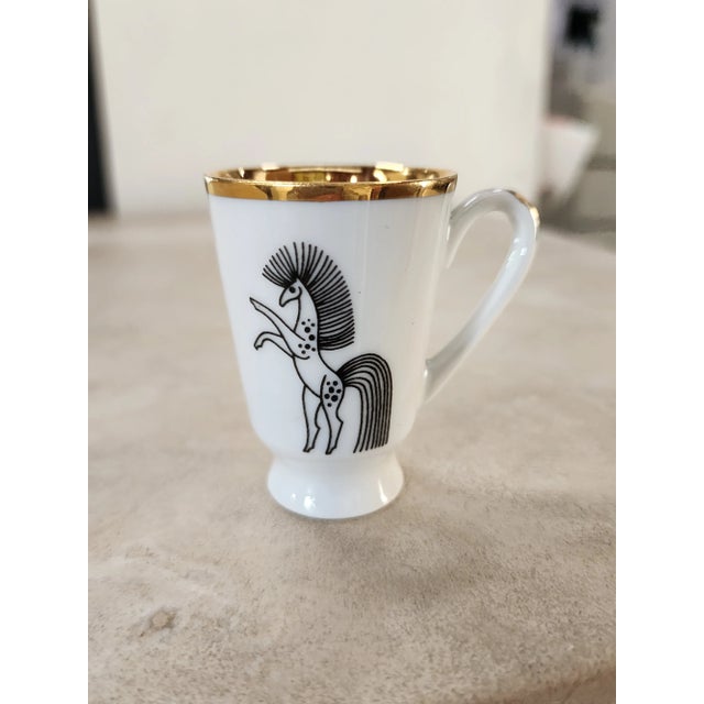 A Set of six Porcelain horse motif Mini Cups. They can be used as shot glasses. Or use them as stunning decor. The gold...