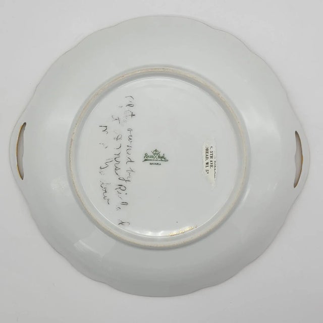 Hand painted with gold gilt handles, here is a stunning piece of artwork from a lost era. Marked Rosenthal on the...