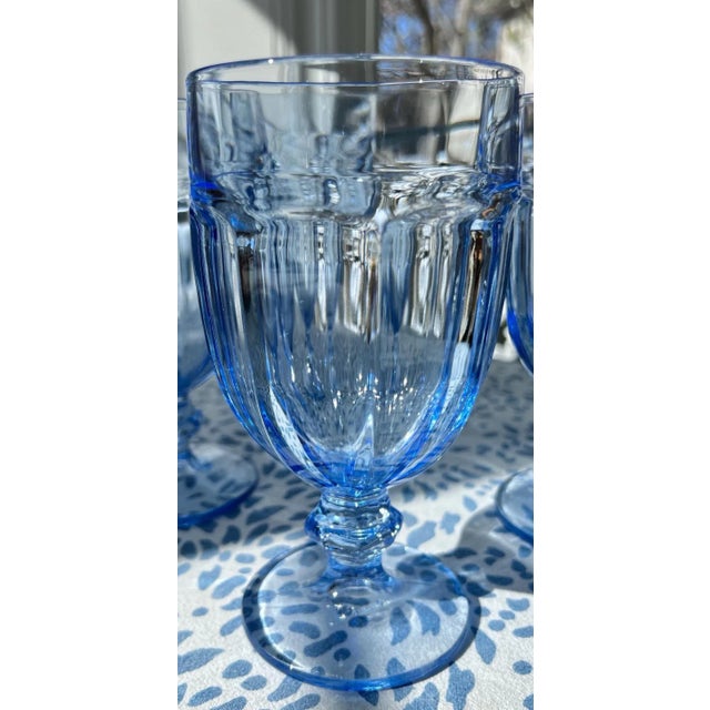 These goblets are a beautiful blue color! They measure 7 inches tall and 3 1/2 across the top. Pre-owned, like new.