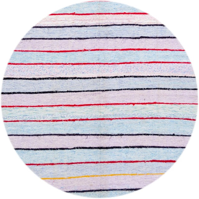 Vintage Turkish Kilim rug with a multicolored lavender and blue striped design. This handwoven flat-weave rug measures...