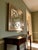 Uttermost Piazzale wall mirror in antique gold finish. Square shape with geometric overlay frame design. Wall-mounted...
